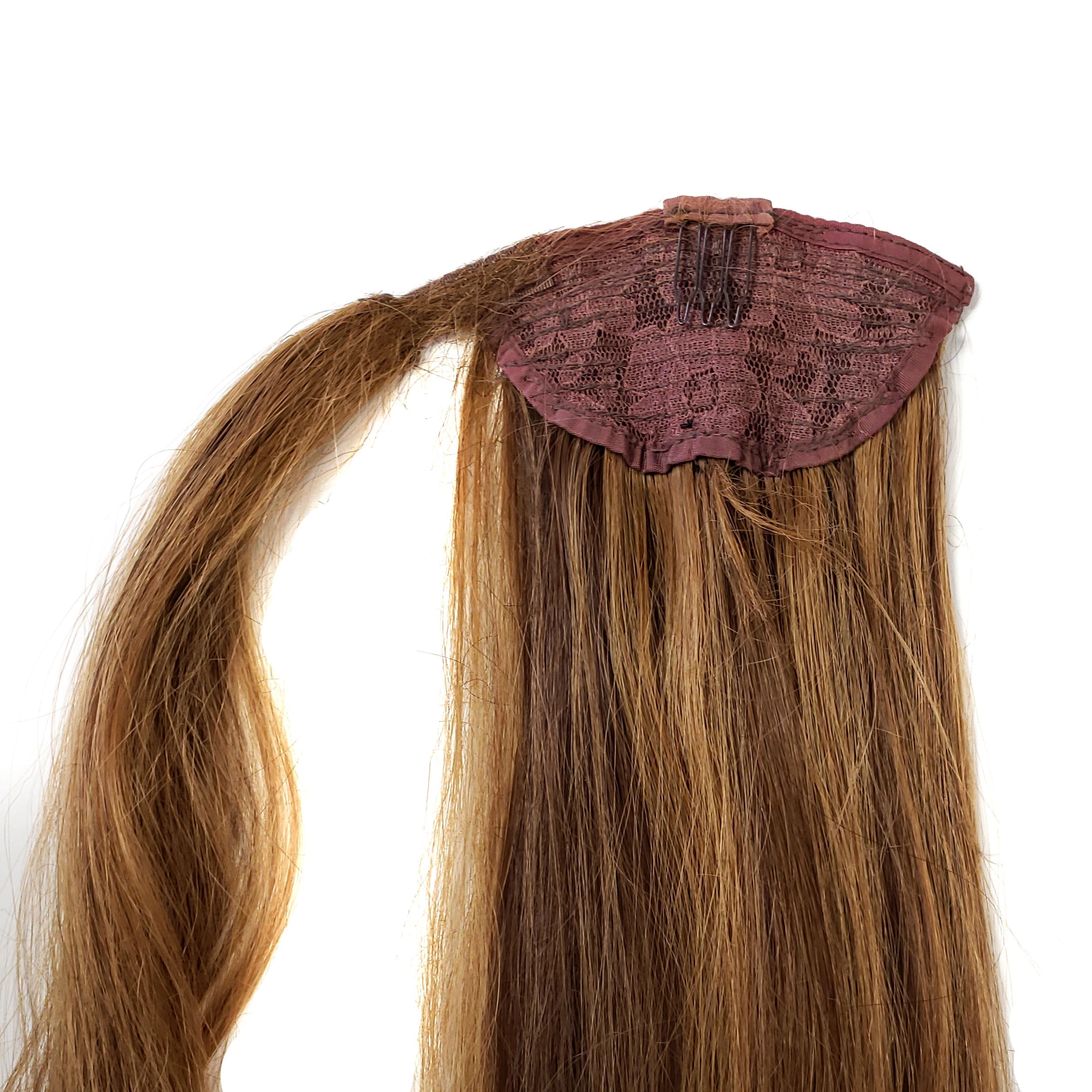 Human hair ponytail piece. Medium brown hair with dark blonde highlights.