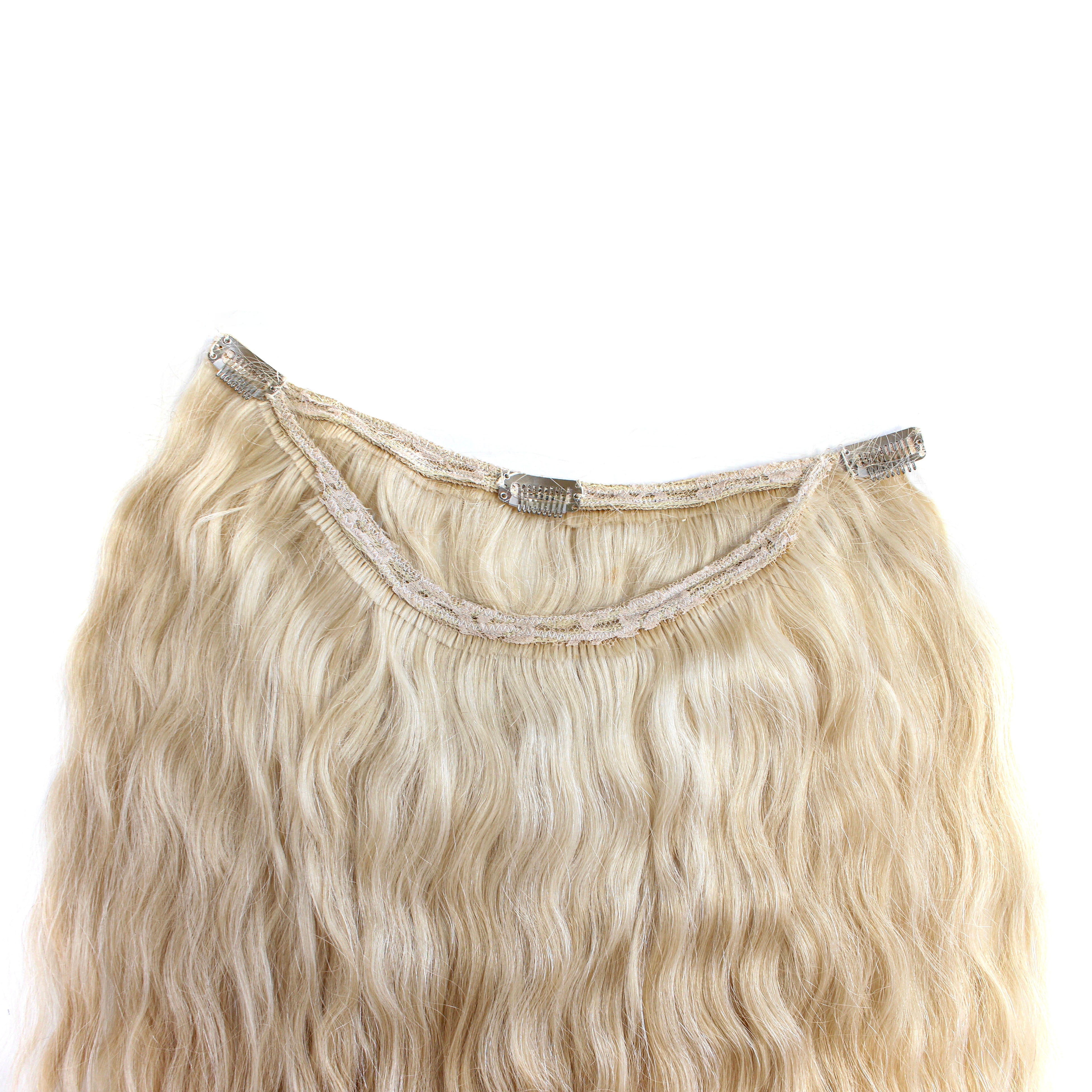 Blonde and wavy clip-in hair extensions. Blonde semi-wavy hair extensions.